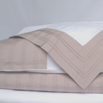 Load image into Gallery viewer, white organic bedding with dusky pink pleat detail
